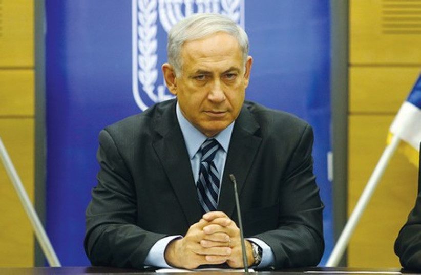 Binyamin Netanyahu speaks at the Knesset on Monday (photo credit: MARC ISRAEL SELLEM/THE JERUSALEM POST)