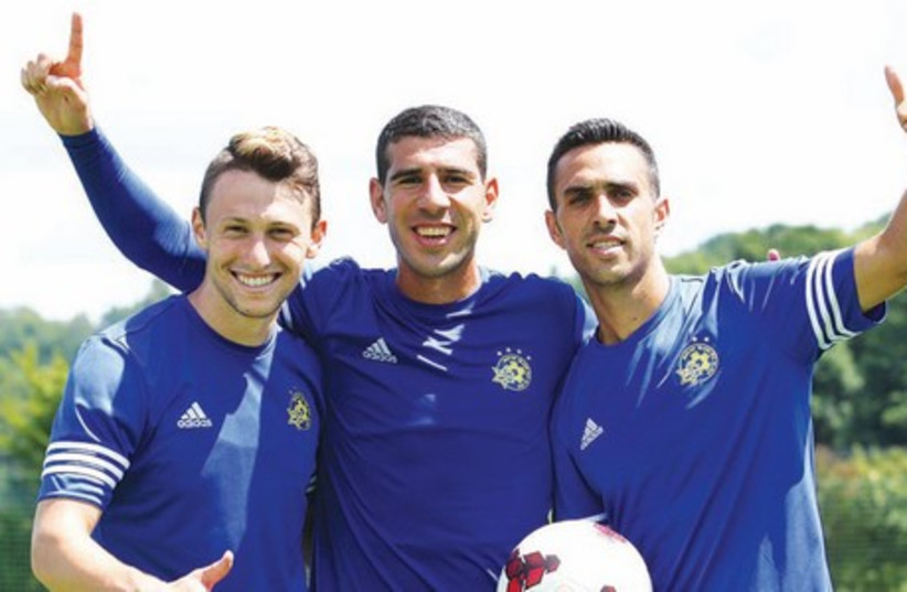 Maccabi Tel Aviv players (including Rade Prica, center) have turned their full focus to Tuesday’s Champions League second qualifying round first leg at Santa Coloma of Andorra after arriving in Barcelona yesterday. (photo credit: MACCABI TEL AVIV WEBSITE)