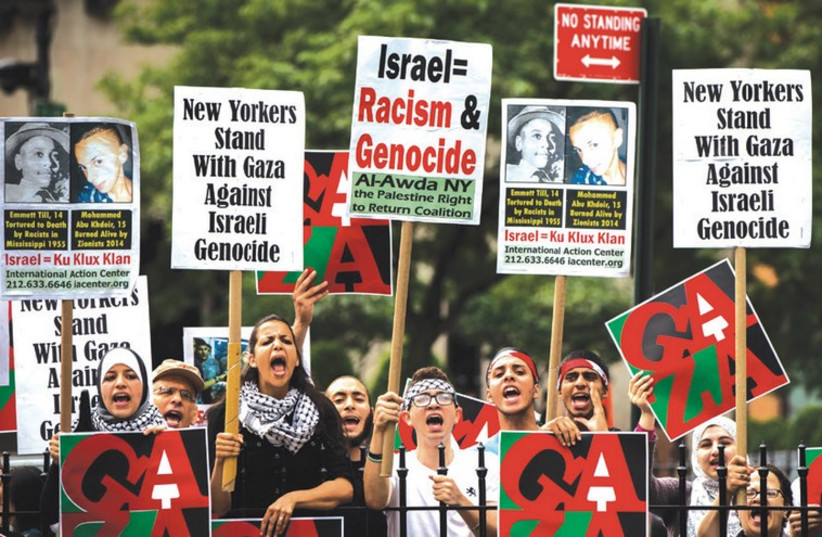 Anti-Israel demonstrators stage a rally outside New York City Hall (photo credit: LUCAS JACKSON / REUTERS)