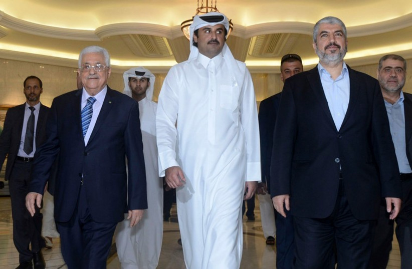 (L R) Palestinian Authority President Mahmoud Abbas, Emir of Qatar Sheikh Tamim bin Hamad al-Thani and exiled Hamas leader Khaled Mashaal arrive for a meeting in Doha. (photo credit: REUTERS)