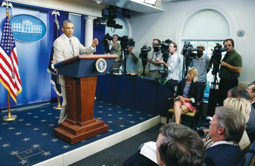 US president Barack Obama addresses reporters in the White House press briefing room, (photo credit: REUTERS)