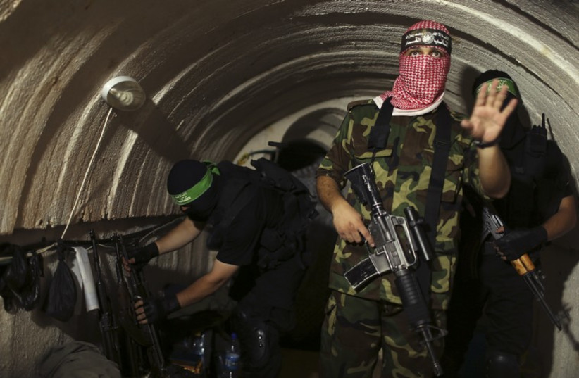 Hamas terror operatives in Gaza tunnel (photo credit: REUTERS)