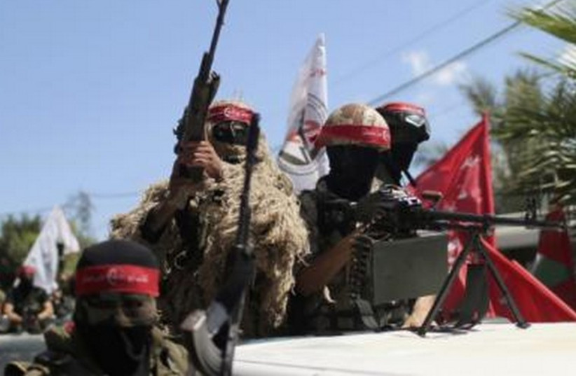 Members of the Popular Front for the Liberation of Palestinian (PFLP) take part in a military show in Gaza City September 2, 2014.  (photo credit: REUTERS)