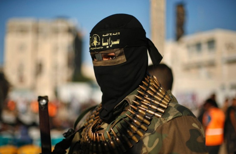 An Islamic Jihad militant attends an anti-Israel rally in Rafah. (photo credit: REUTERS)
