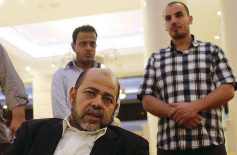 Deputy chairman of Hamas’s political bureau Musa Abu Marzouk talks during an interview in Cairo on August 9. (photo credit: REUTERS)