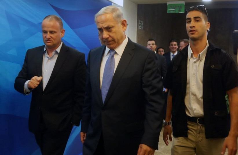 Prime Minister Benjamin Netanyahu enters cabinet meeting (photo credit: MARC ISRAEL SELLEM/THE JERUSALEM POST)
