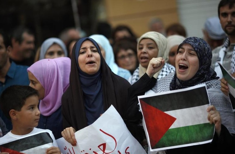 Pro-Palestinian demonstrators during a protest against Operation Protective edge, in Malaga, Spain, August 8, 2014. (photo credit: REUTERS)
