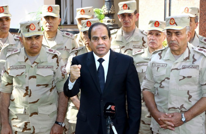 Egyptian President Abdel Fattah al-Sisi gives a speech outside the Supreme Council in Cairo  (photo credit: REUTERS)