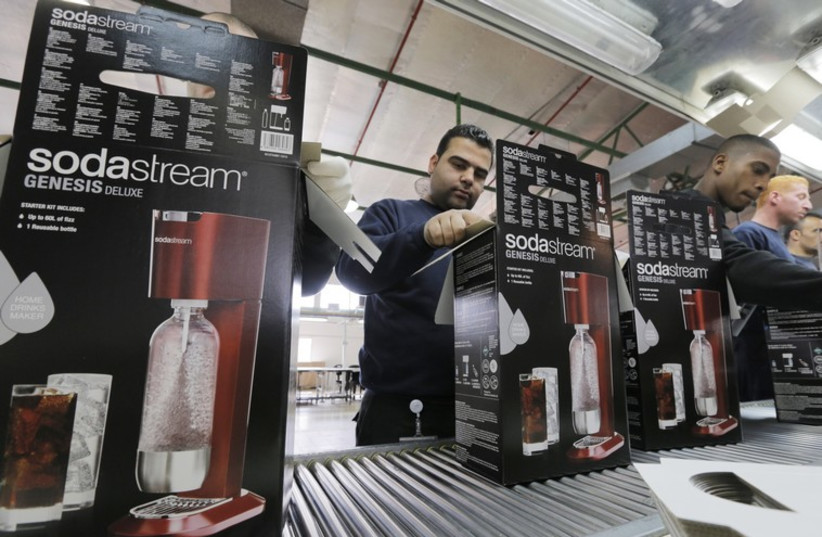 Employees at a SodaStream factory (photo credit: REUTERS)