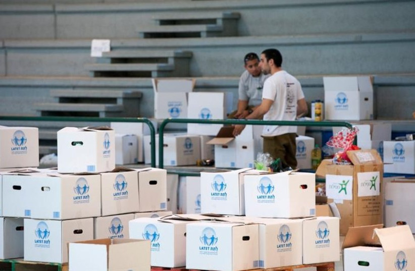 Boxes of food for the poor (photo credit: LATET)