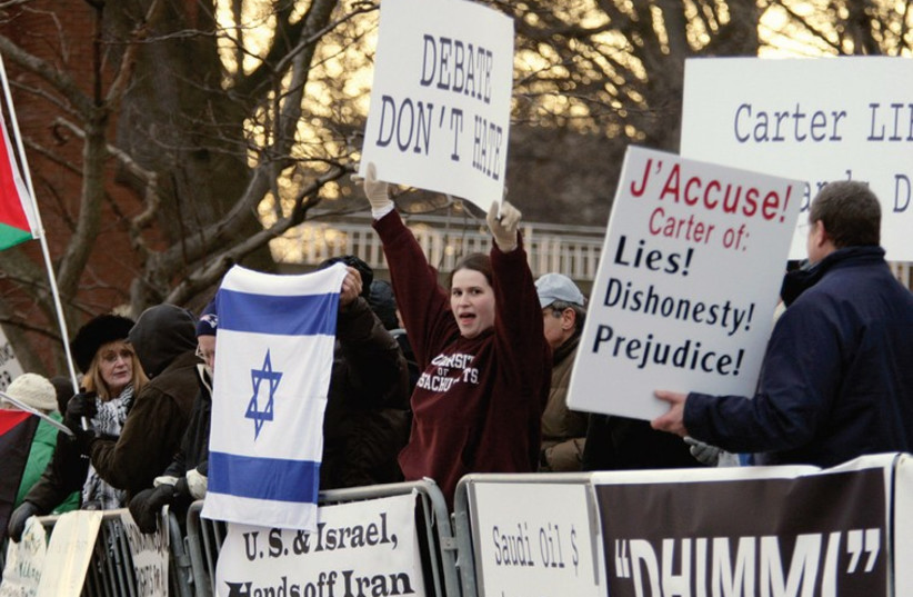 DEMONSTRATORS PROTEST at Brandeis University against former US president Jimmy Carter’s book about the Israeli-Palestinian conflict. (photo credit: REUTERS)