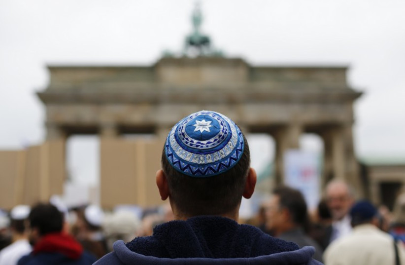 A man wearing a kippah at Berlin's Brandenburg Gate. (photo credit: REUTERS)