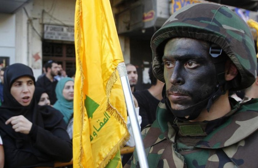 Lebanese Hezbollah supporters march during a religious procession in Nabatieh (photo credit: REUTERS)