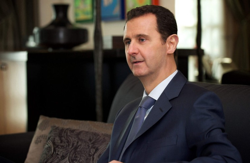 Syria's President Bashar al-Assad is seen during an interview to the American magazine Foreign Affairs in Damascus. (photo credit: REUTERS)
