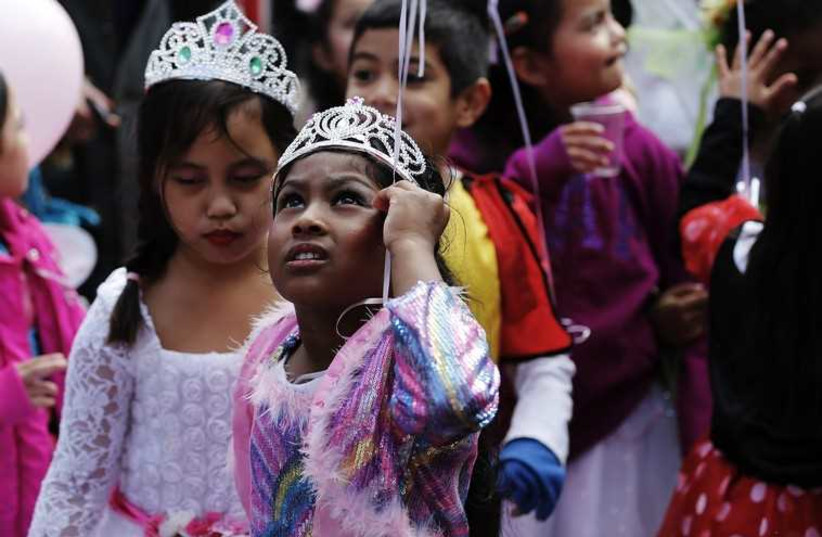 Children dressed up for Purim (photo credit: REUTERS)