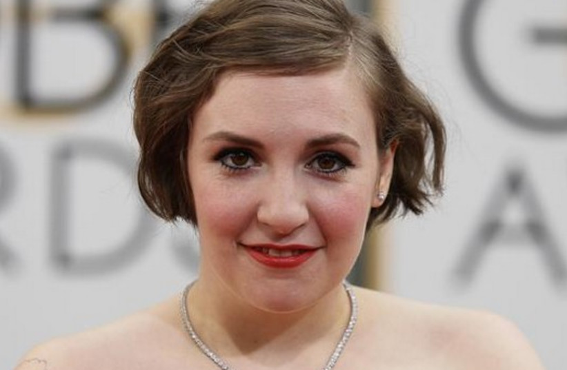 Actress Lena Dunham arrives at the 71st annual Golden Globe Awards in Beverly Hills, California  (photo credit: REUTERS)