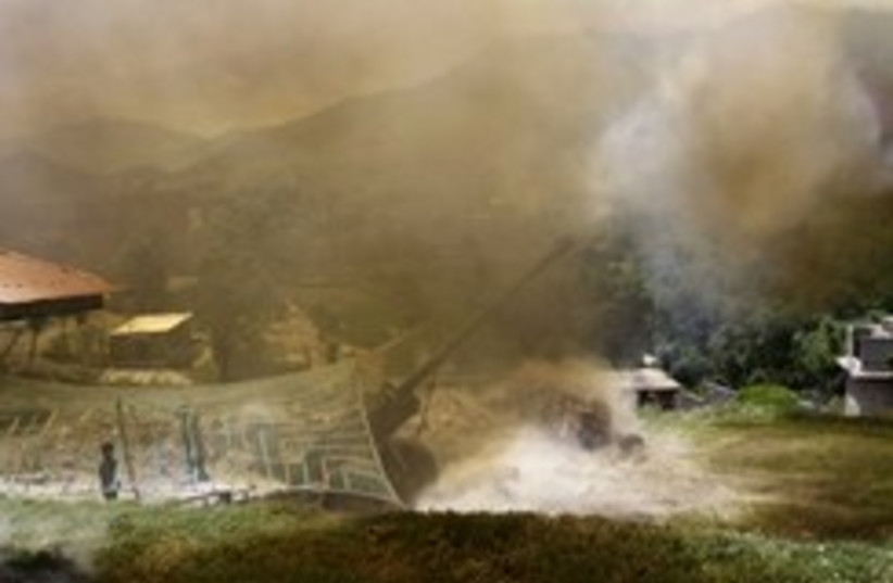 pakistani army fire artillery 248 88 (photo credit: AP)