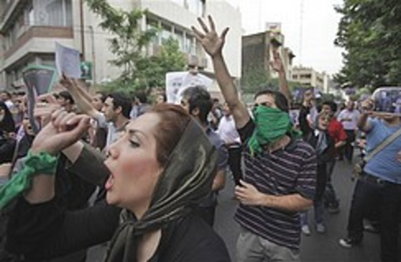 Iran protest woman shouts 248.88 (photo credit: AP)