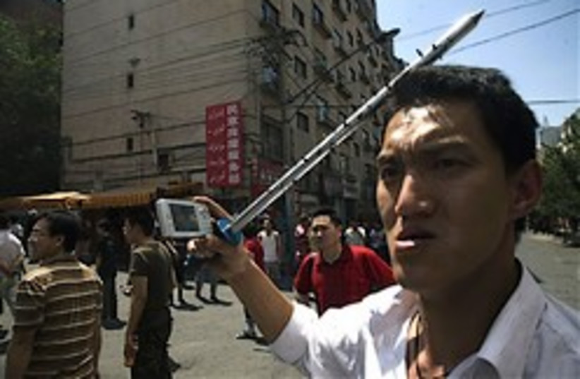 china Uighur urumqi riots 248 88 ap (photo credit: )