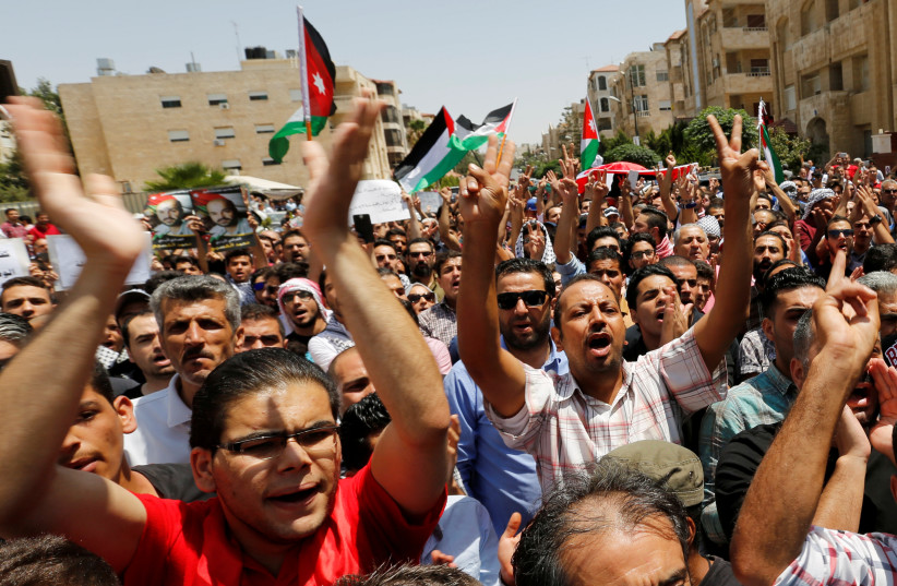 Protestors chanting slogans during a demonstration near the Israeli embassy in Amman, Jordan July 28, 2017.  (photo credit: REUTERS)