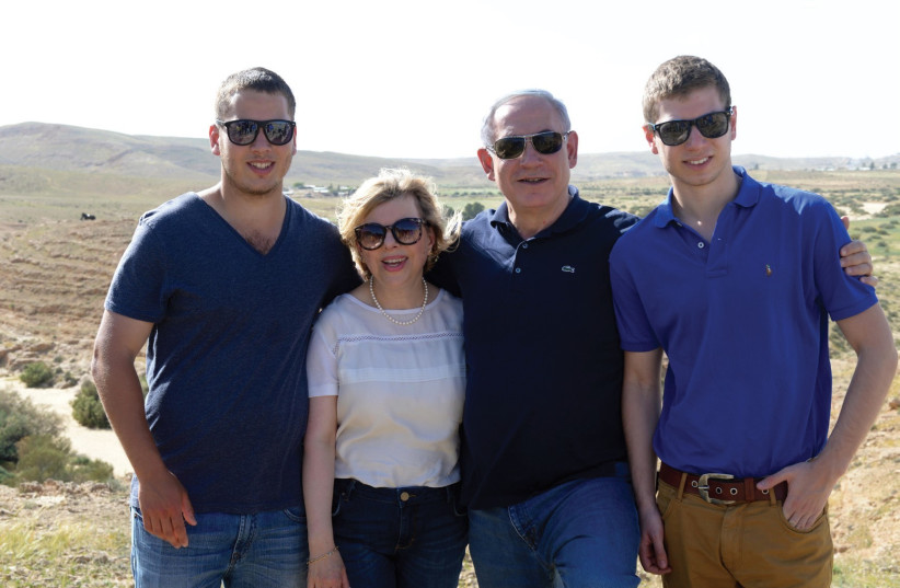 Prime MinisterBenjamin Netanyahu with family, Sara Avner (left) and Yair.   (photo credit: AMOS BEN GERSHOM, GPO)