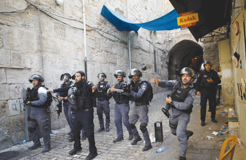 Border police confront protestors in the Old City of Jerusalem. (photo credit: REUTERS)