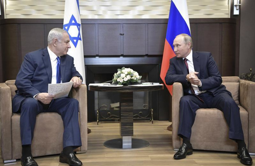 Russian President Vladimir Putin (R) meets with Israeli Prime Minister Benjamin Netanyahu in Sochi, Russia August 23, 2017. (photo credit: SPUTNIK/ALEXEI NIKOLSKY/KREMLIN VIA REUTERS)