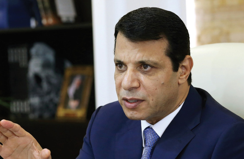 MOHAMMED DAHLAN, a former Fatah security chief, gestures in his office in Abu Dhabi, United Arab Emirates, last year. (photo credit: REUTERS)