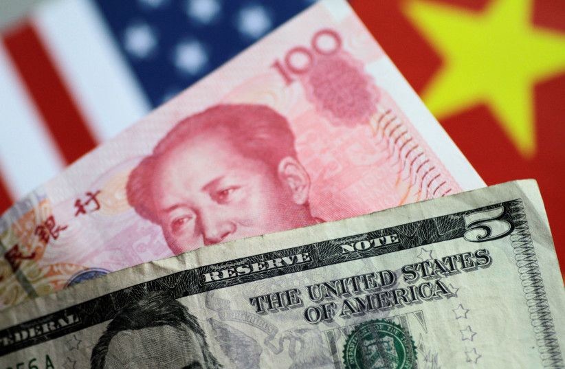 The Dollar and Yuan compete for influence. (photo credit: REUTERS)