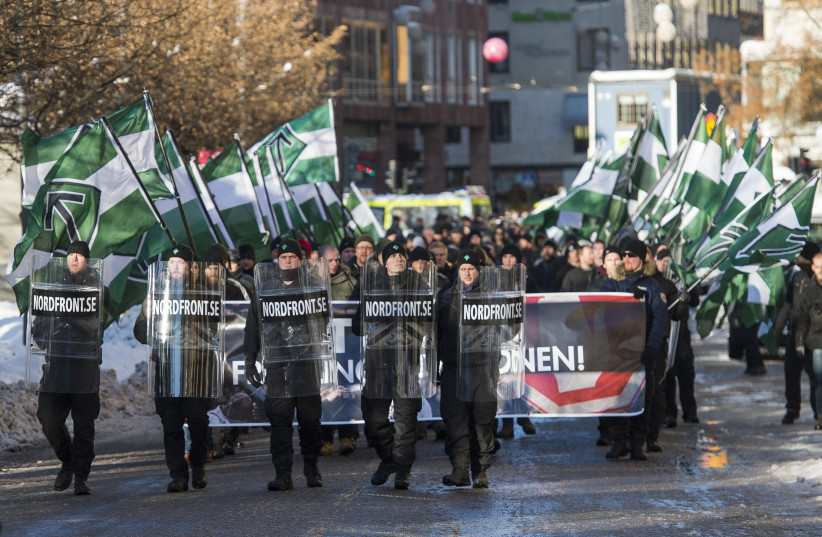 The neo-nazi Nordic Resistance Movement (Nordiska motstandsrorelsens) sympathisers demonstrate in central Stockholm (photo credit: JONATHAN NACKSTRAND/AFP)