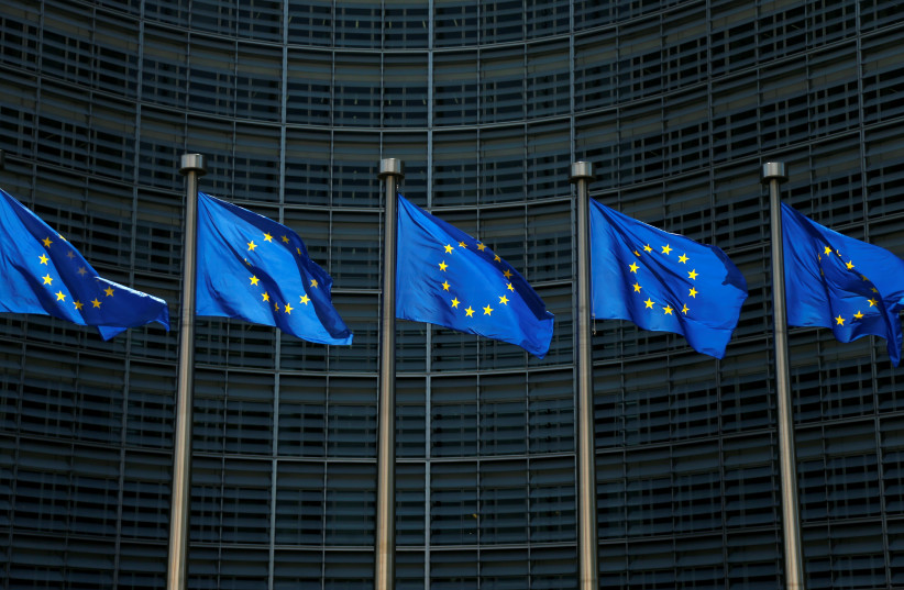 EU flags flutter outside the EU Commission headquarters in Brussels. (photo credit: REUTERS/FRANCOIS LENOIR)