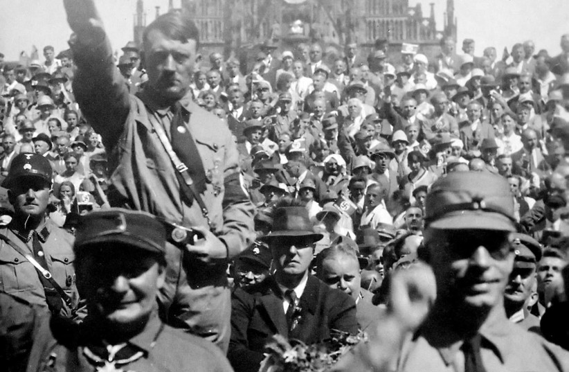 Hitler and Hermann Göring saluting at a 1928 Nazi Party rally in Nuremberg (photo credit: PUBLIC DOMAIN / HEINRICH HOFFMANN / US NATIONAL ARCHIVES AND RECORDS ADMINISTRATION)