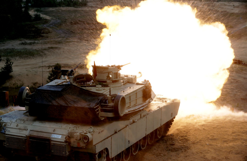 A US M1 Abrams tank fires during the "Saber Strike" NATO military exercise in Adazi, Latvia, June 11, 2016. (photo credit: REUTERS)