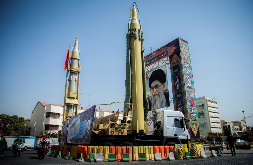 A display of missiles and a portrait of Supreme Leader Ayatollah Ali Khamenei in Tehran (photo credit: REUTERS)