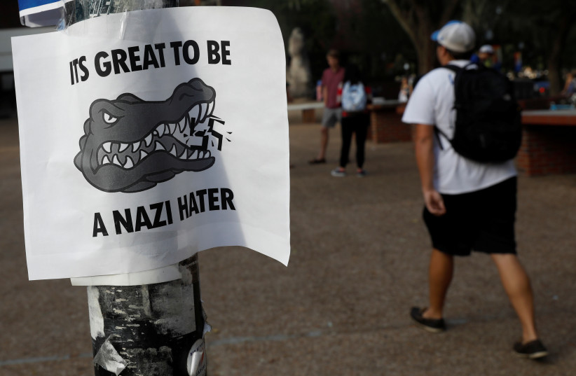 A flier is seen on a pole the day before a speech by Richard Spencer, an avowed white nationalist and spokesperson for the so-called alt-right movement, on the campus of the University of Florida in Gainesville, Florida, US, October 18, 2017. (photo credit: SHANNON STAPLETON / REUTERS)