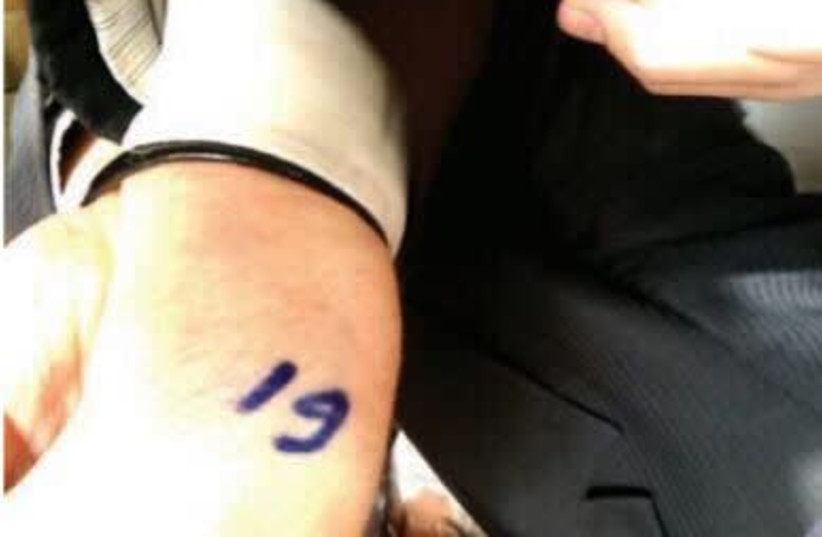 A Haredi Jewish man who was marked with a number  (photo credit: COMMITTEE FOR SAVING THE TORAH WORLD)