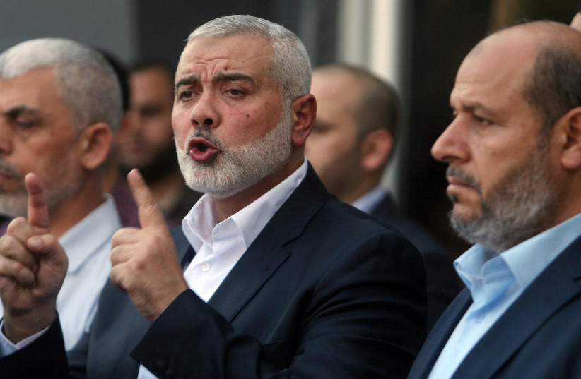 Hamas Chief Ismail Haniyeh gestures during a news conference following his arrival at the Rafah border crossing in the southern Gaza Strip September 19, 2017.  (photo credit: REUTERS)