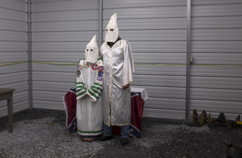 A female and male member of the Virgil Griffin White Knights, a group that claims affiliation with the Ku Klux Klan. (photo credit: REUTERS)