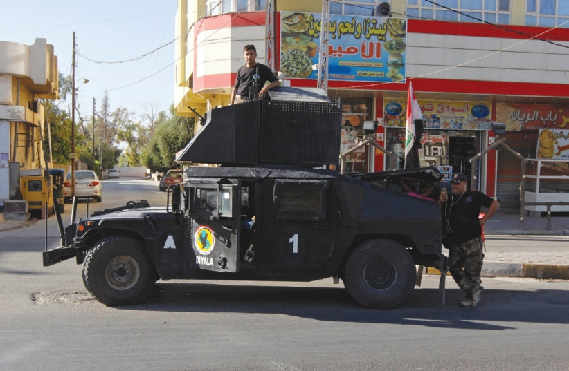 A VEHICLE of the Iraqi Federal Police is seen on a street in Kirkuk last month. (photo credit: AKO RASHEED / REUTERS)