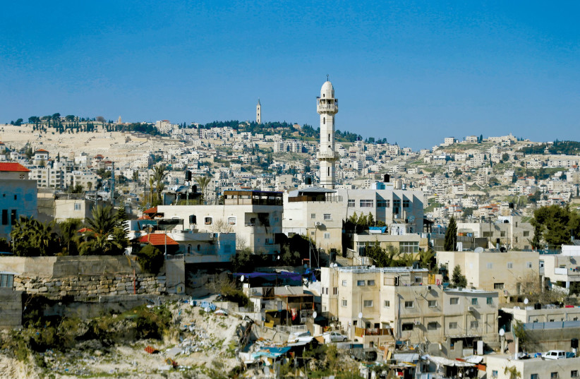 THE MINARET of a mosque is seen near the East Jerusalem neighbourhood of Silwan (photo credit: REUTERS)