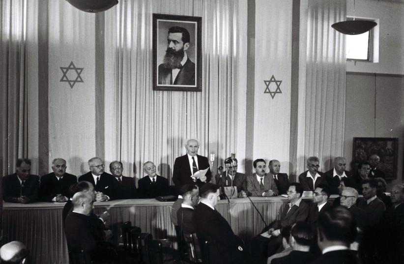 DAVID BEN-GURION reads the declaration of Israel’s independence in Tel Aviv in 1948 (photo credit: KLUGER ZOLTAN/GPO)