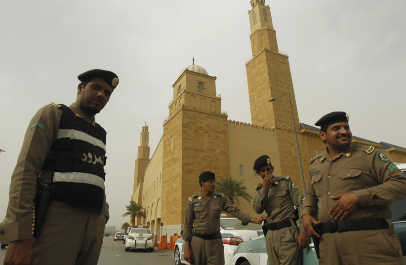 Policemen stand outside al Rajhi Mosque in Riyadh, Saudi Arabia, March 11, 2011. (photo credit: REUTERS)