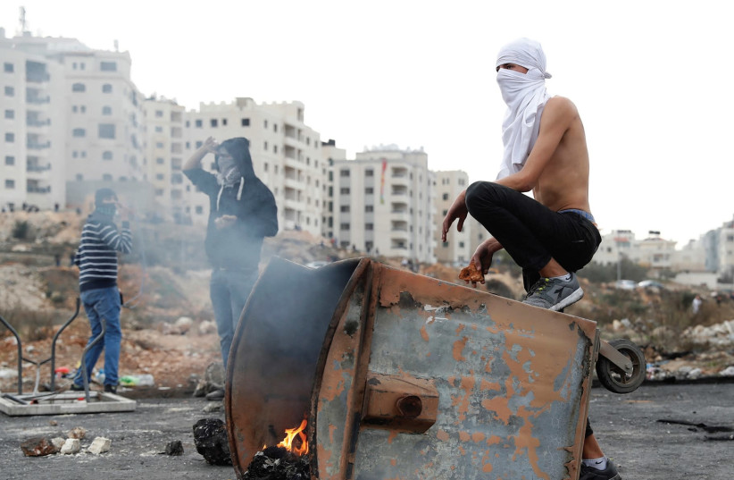 Extremists burning trash.  (photo credit: REUTERS)