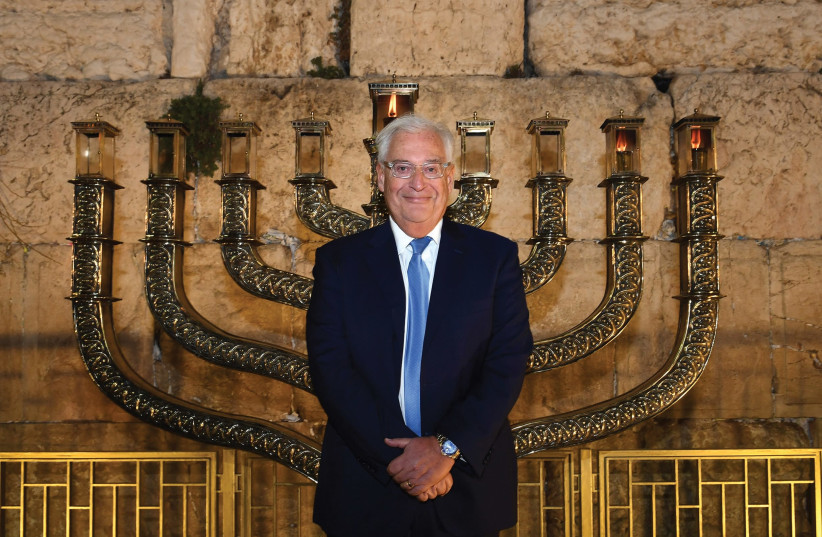 US Ambassador to Israel David Friedman stands at the Western Wall after lighting the menorah there for the second night of Hanukkah, 2018 (photo credit: Courtesy)
