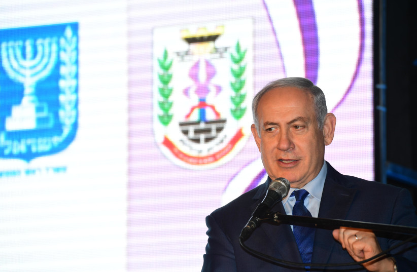 Prime Minister Benjamin Netanyahu at the signing ceremony of a comprehensive agreement in Nazareth Illit, December 28, 2017. (photo credit: AMOS BEN GERSHOM, GPO)