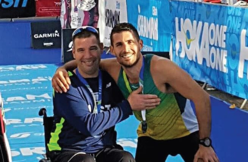 Avi De-Pilosof (left) will be making his return to true competition on Friday when he participates in the Tiberias marathon in his new racing wheelchair. (photo credit: Courtesy)
