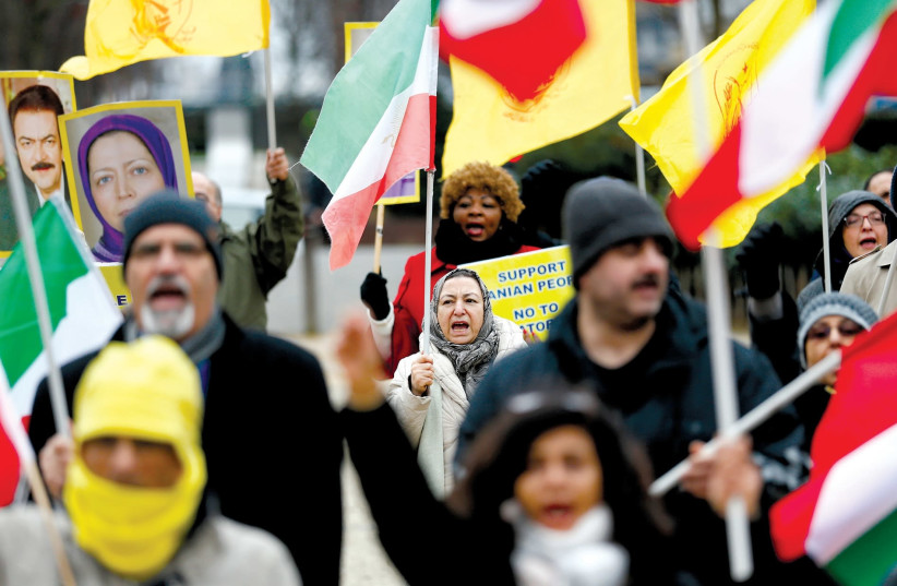 Protesters supporting the Iranian protests outside the European Union Council in Brussels, Belgium. (photo credit: REUTERS/FRANCOIS LENOIR)