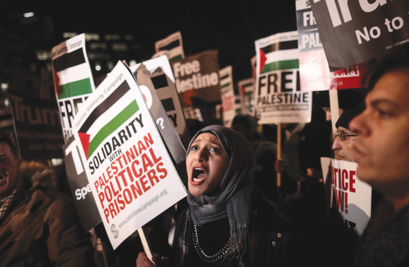 Protesters in London demonstrate in December outside the US Embassy against President Donald Trump’s decision to recognize Jerusalem as Israel’s capital. (photo credit: SIMON DAWSON/ REUTERS)