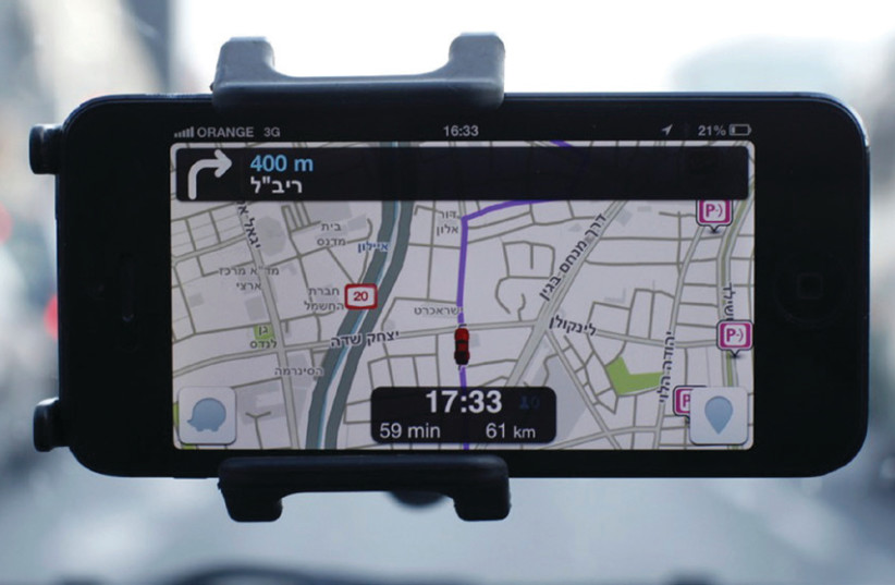 Waze, an Israeli mobile satellite navigation application, has revolutionized driving (photo credit: REUTERS/NIR ELIAS)
