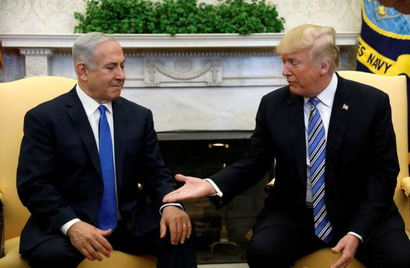 U.S. President Donald Trump meets with Israel Prime Minister Benjamin Netanyahu in the Oval Office of the White House in Washington, U.S., March 5, 2018. REUTERS/Kevin Lamarque (photo credit: REUTERS/KEVIN LAMARQUE)